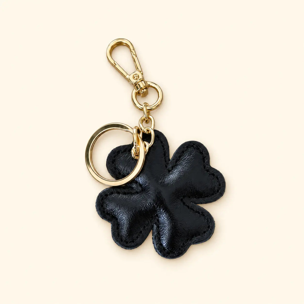 Portachiavi charm borsa quadrifoglio pelle nero laminato